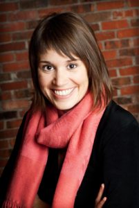 Wendy Graham with scarf with brick wall background