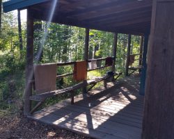 Towels on rail of cabin porch