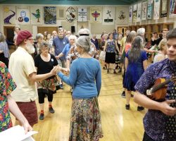People dancing in the hall from the vantage point of the stage