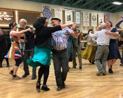 Dancers swinging in the dance hall