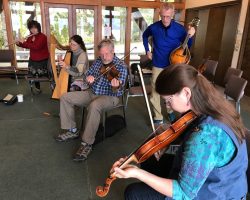 Campers with their instruments in a band workshop